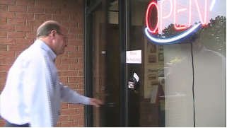 Video Screenshot Our Customer, Ron, Entering our Sign Shop