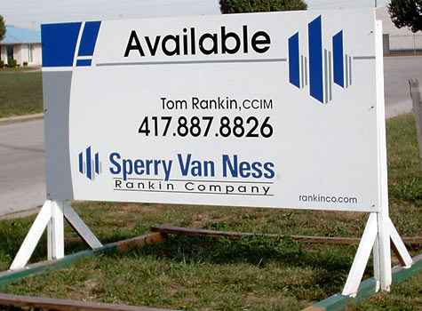 photograph of a large wooden business sign