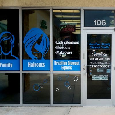 Blue background with white text with man and woman silhouettes. Text reads: Family Haricuts Brazilian Blowout Experts